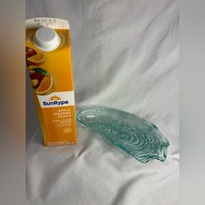 Teal coloured, oyster shaped glass dish